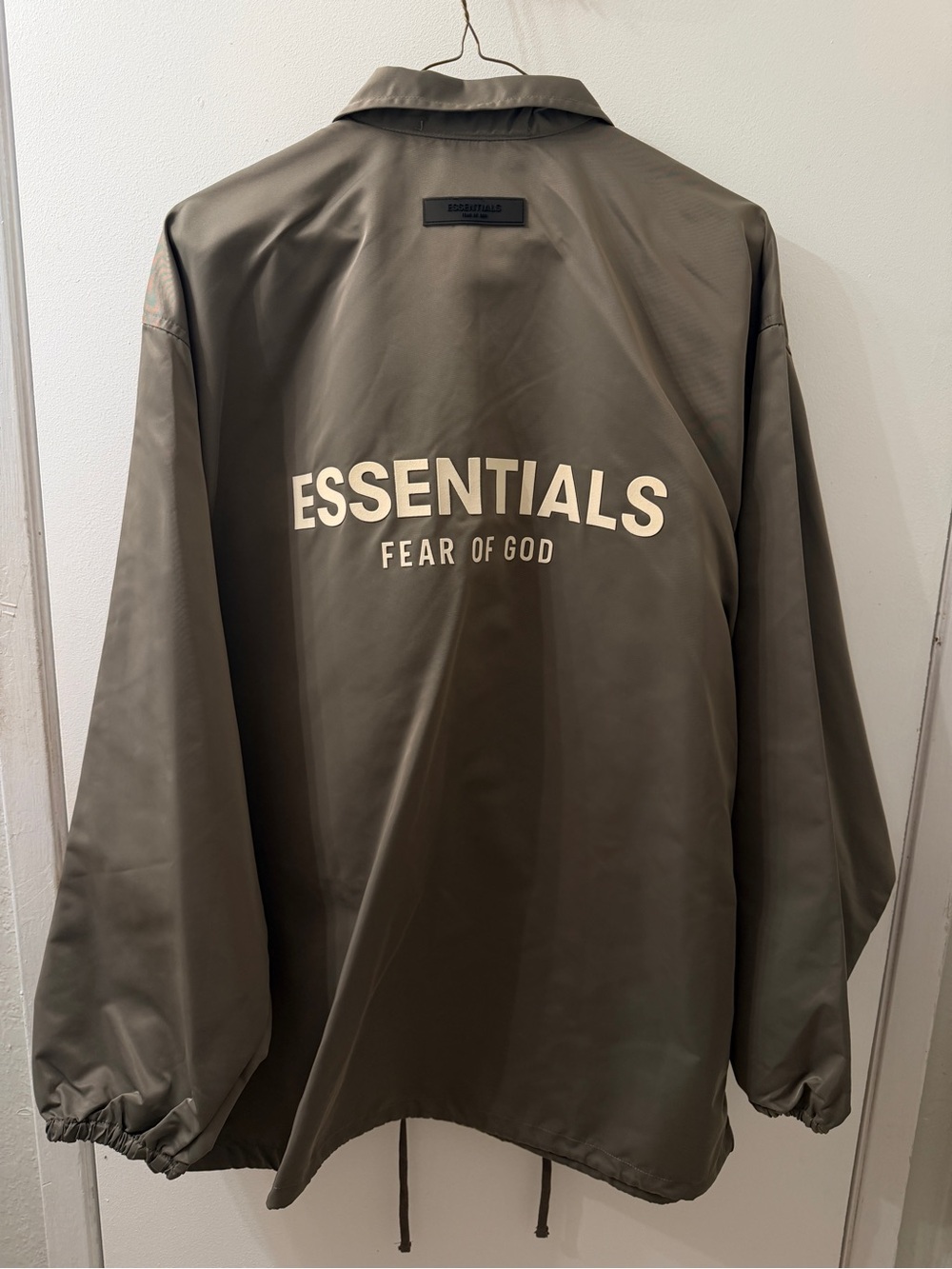 Essentials Fear of God Olive Green Coach Jacket with Cream Logo